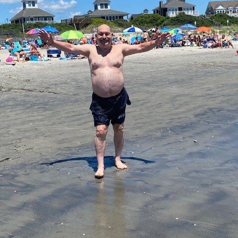 Elderly resident at a group outing at the beach