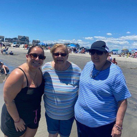 Elderly resident at a group outing at the beach