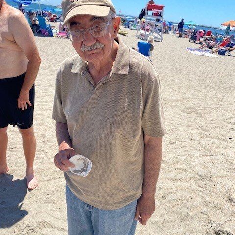 Elderly resident at a group outing at the beach